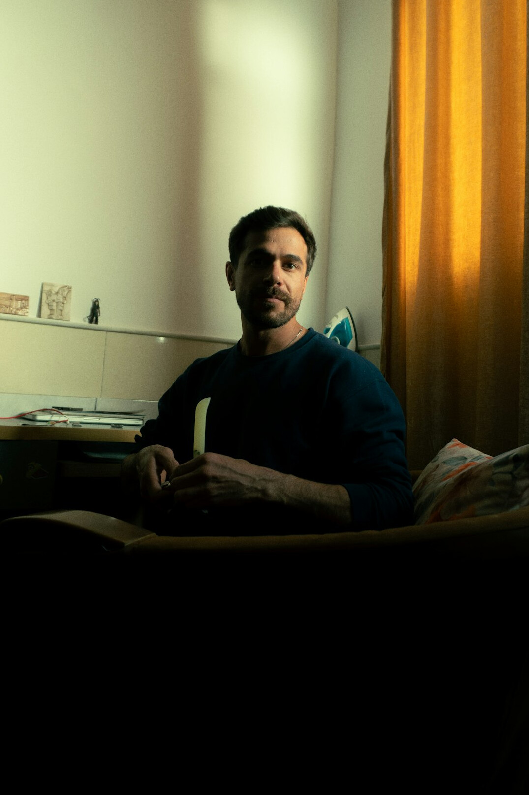 person reading book in quiet room