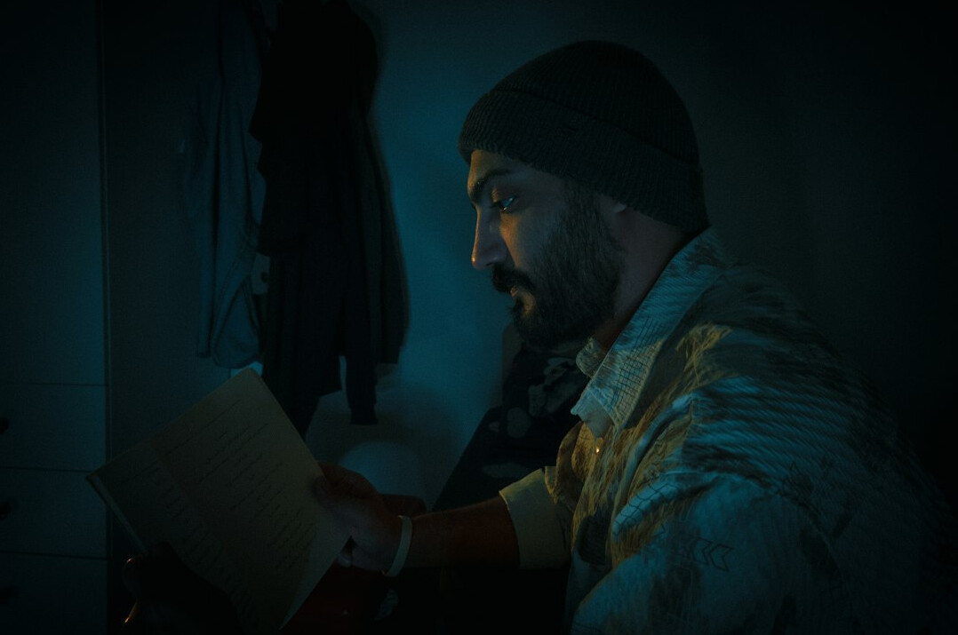 person reading book in quiet room