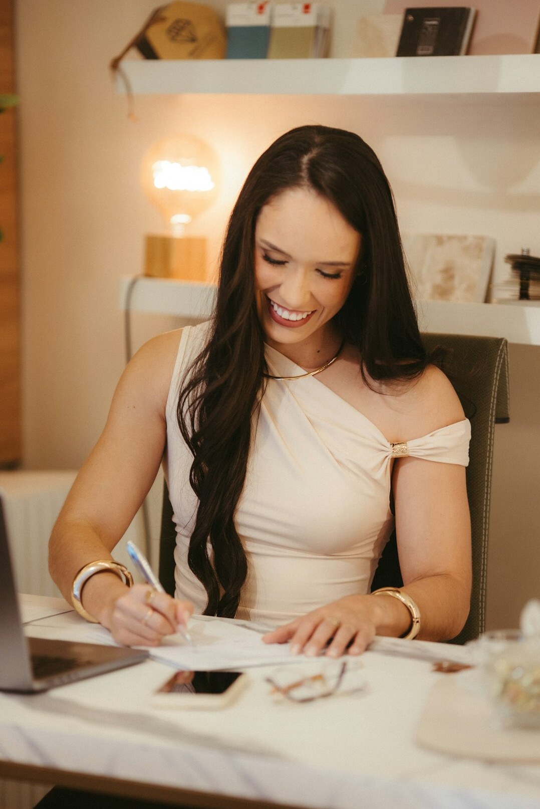 woman journaling at desk